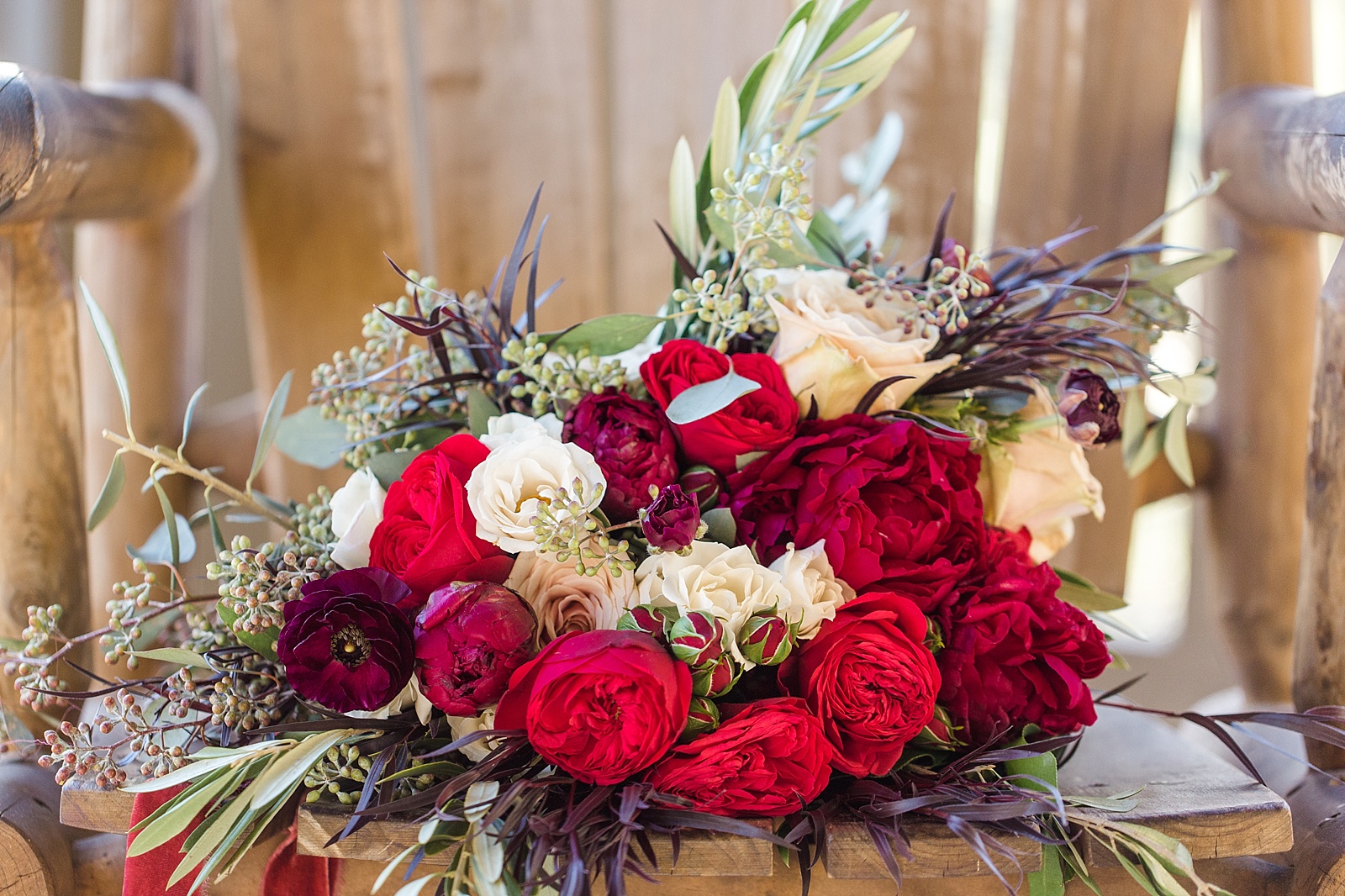 Brianna Belton design bridal bouquet; red, moody winter tones