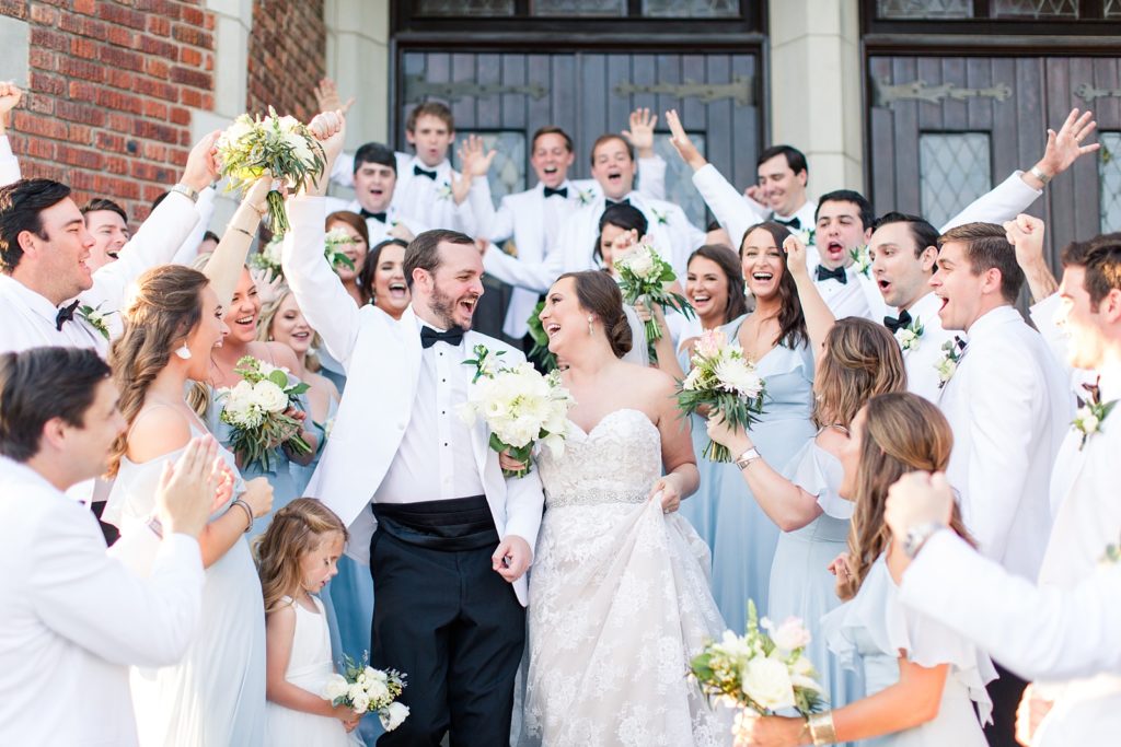 Bridal party cheers as bride and groom exit First Presbyterian Church Shreveport