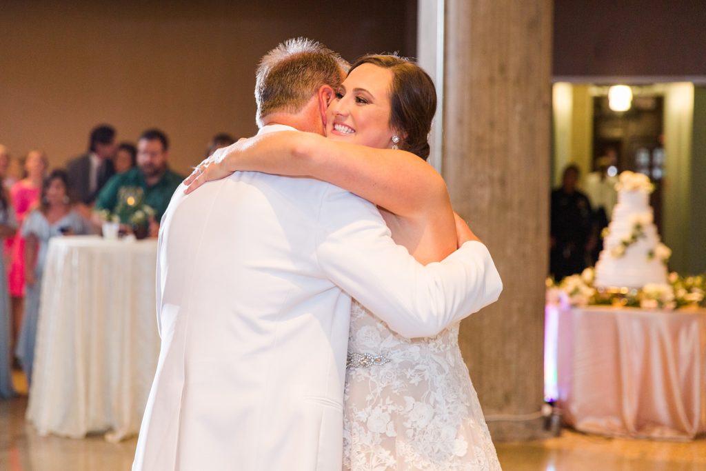Bride hugs father at 601 Spring