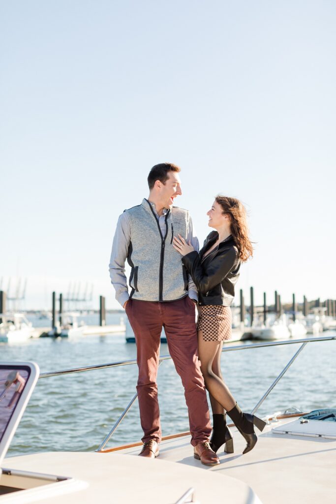 Newly engaged couple on boat at Daniel Island Yacht Club in Charleston, South Carolina; Proposal photography