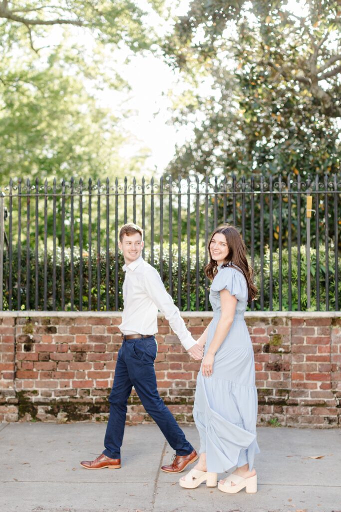 couple walking the streets in downtown Charleston