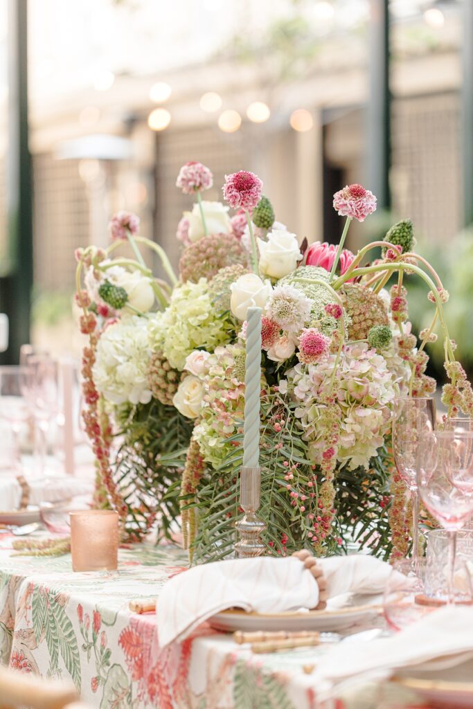 pink and green floral arrangement and tablescape at Hotel Emeline, Charleston, South Carolina